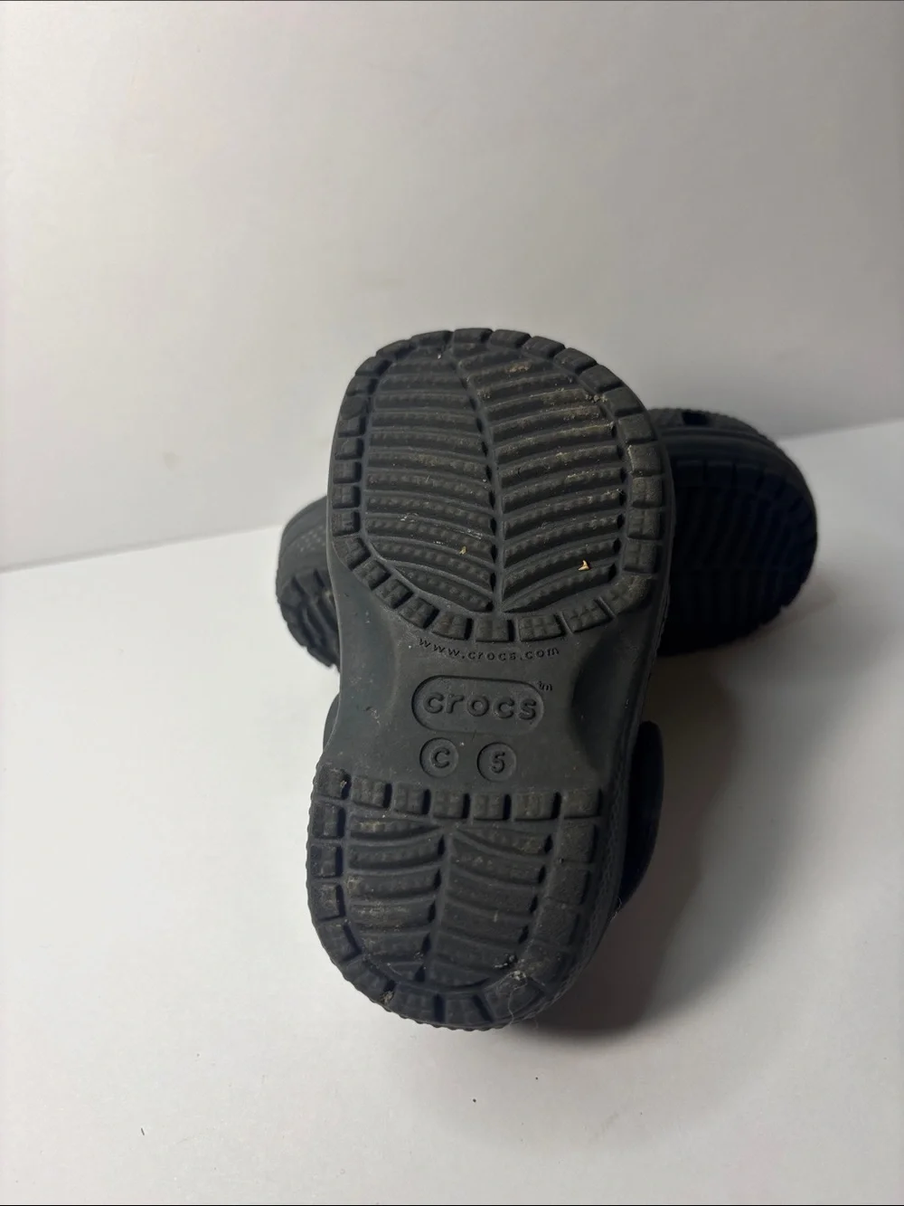 CROCS Kids Black Clogs with Orange Accent Charm